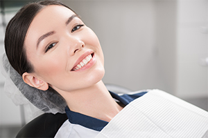 Woman smiling after dental bonding