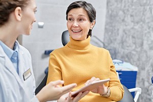 Dentist and patient conversing about treatment options