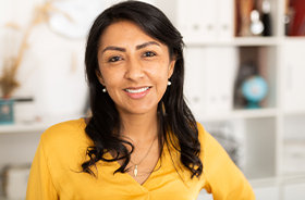 Woman smiling after visiting the dentist