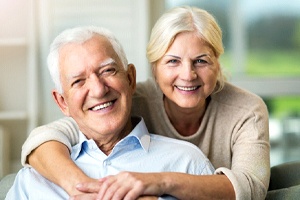 Senior couple enjoying the many benefits of All-on-4 dental implants