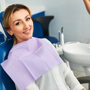Smiling dental patient in treatment chair