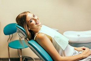 Smiling dental patient with braces