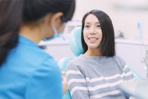 Dental patient learning about extractions vs. root canal therapy