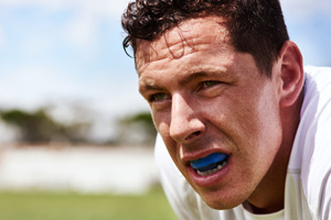 Athlete wearing a blue mouthguard