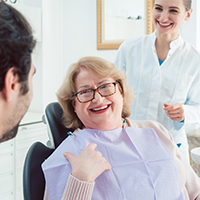 Woman smiling after lost filling replacement