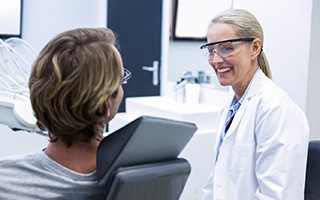 Dentist and patient discussing treatment options