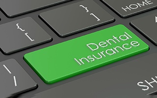 Close-up of “dental insurance” key on computer keyboard