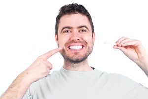 Happy man enjoying the benefits of Invisalign® treatment