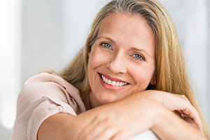 Woman smiling after oral cancer screening