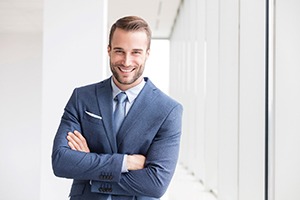 Handsome, confident businessman enjoying the benefits of his veneers