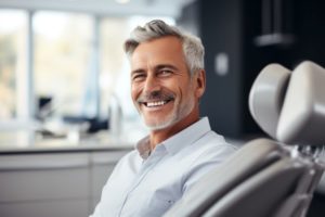 Smiling senior man in dental treatment chair