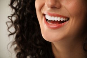 Close-up of woman’s beautiful smile with veneers 