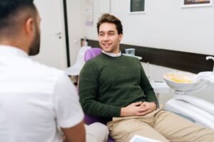 Dentist and patient talking in relaxed setting